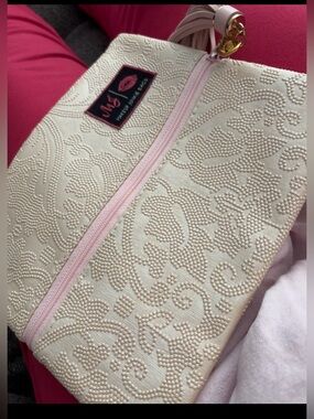 Cream Embossed Cosmetic Pouch with Pink Trim